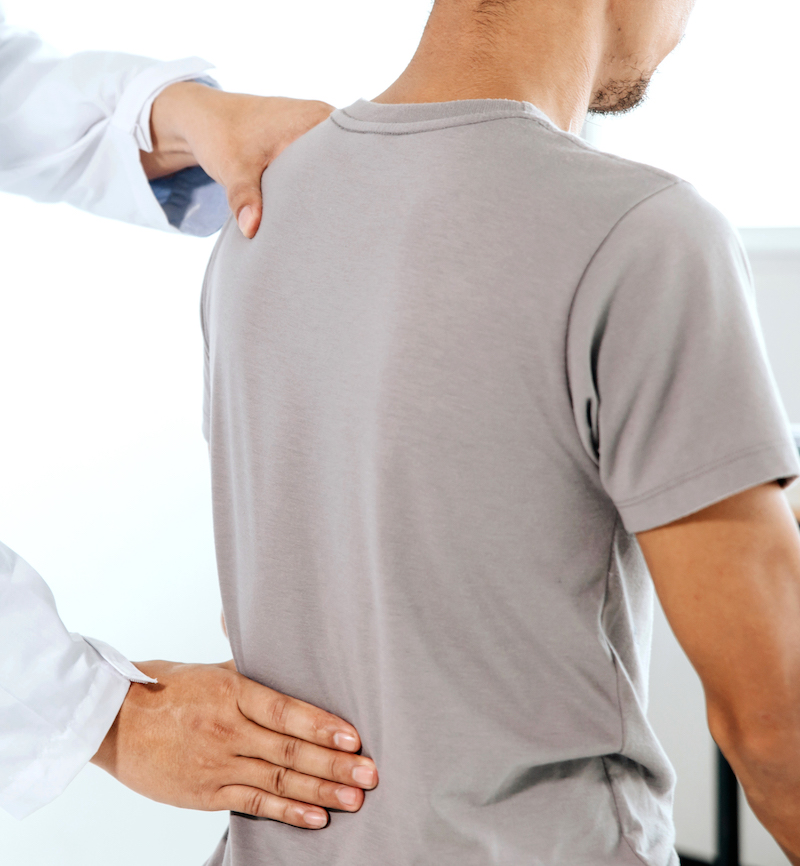 physiotherapist-doing-healing-treatment-man-s-back-back-pain-patient-massage-therapist