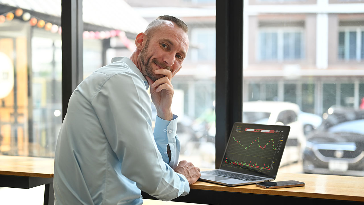 caucasian-businessman-using-laptop-with-financial-2023-11-27-05-12-29-utc.jpg