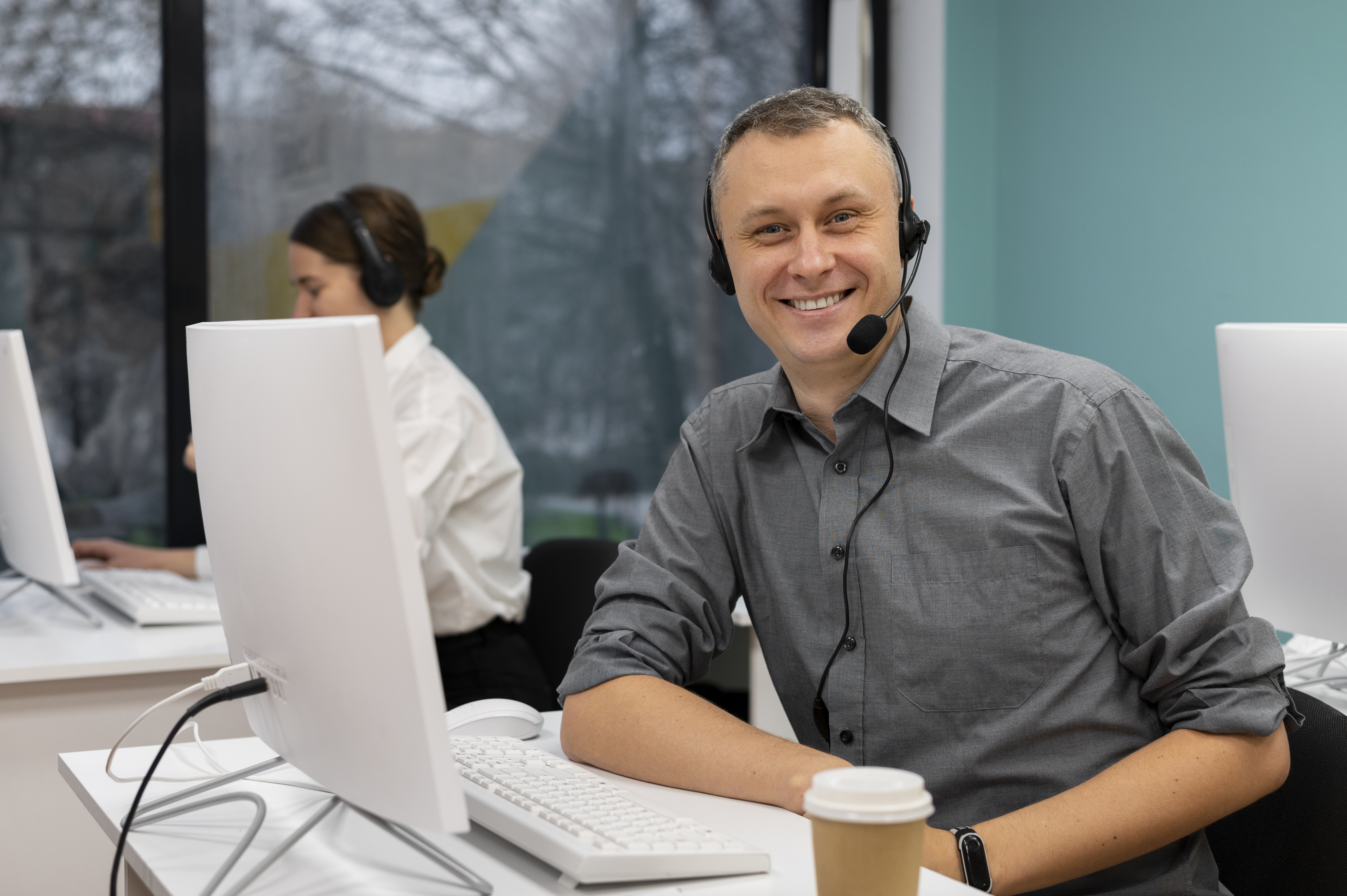 man-with-headphones-working-call-center-office (1).jpg
