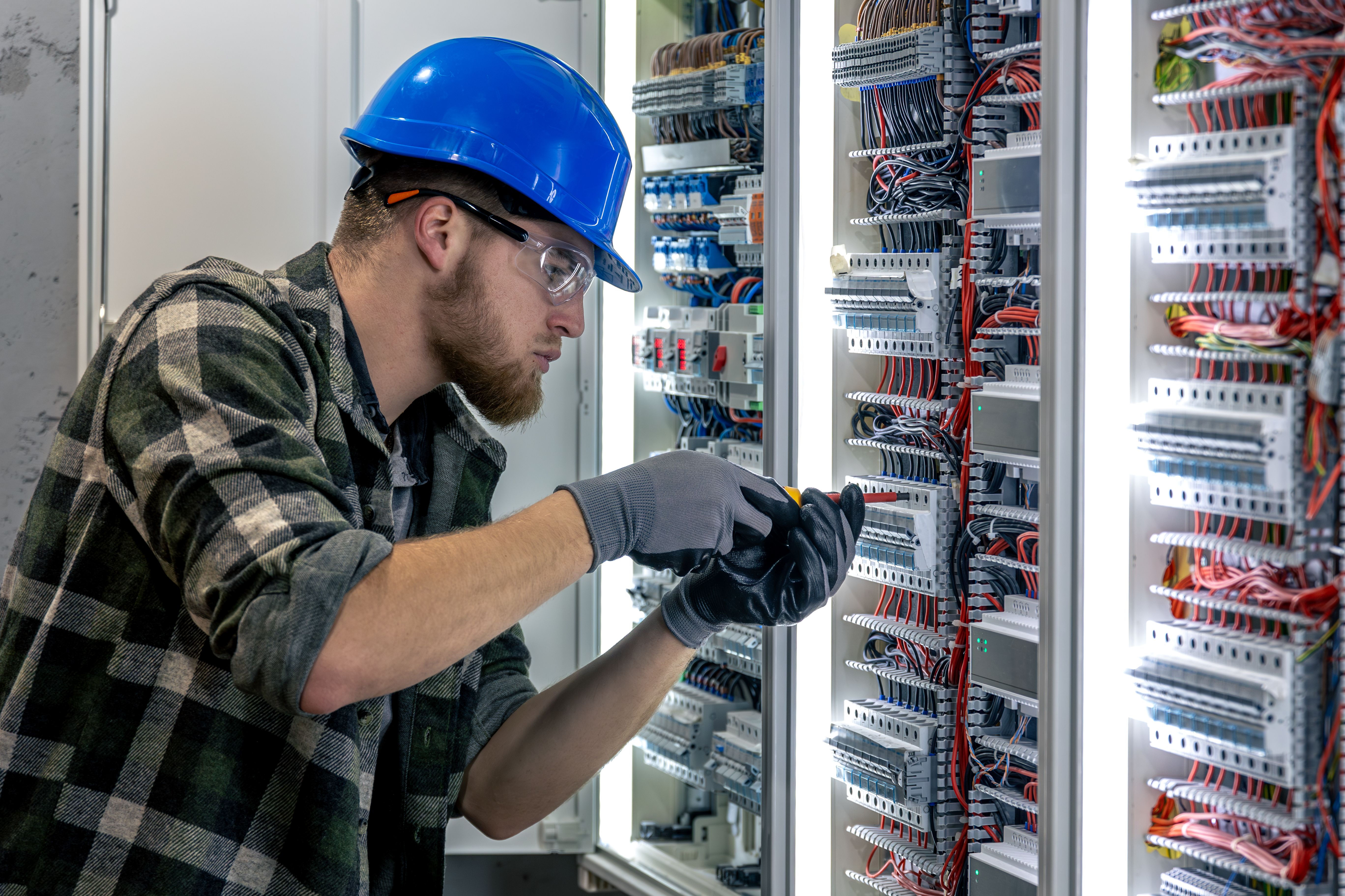 electrician-inspects-switchboard-wiring-check-screwdriver-hand.jpg