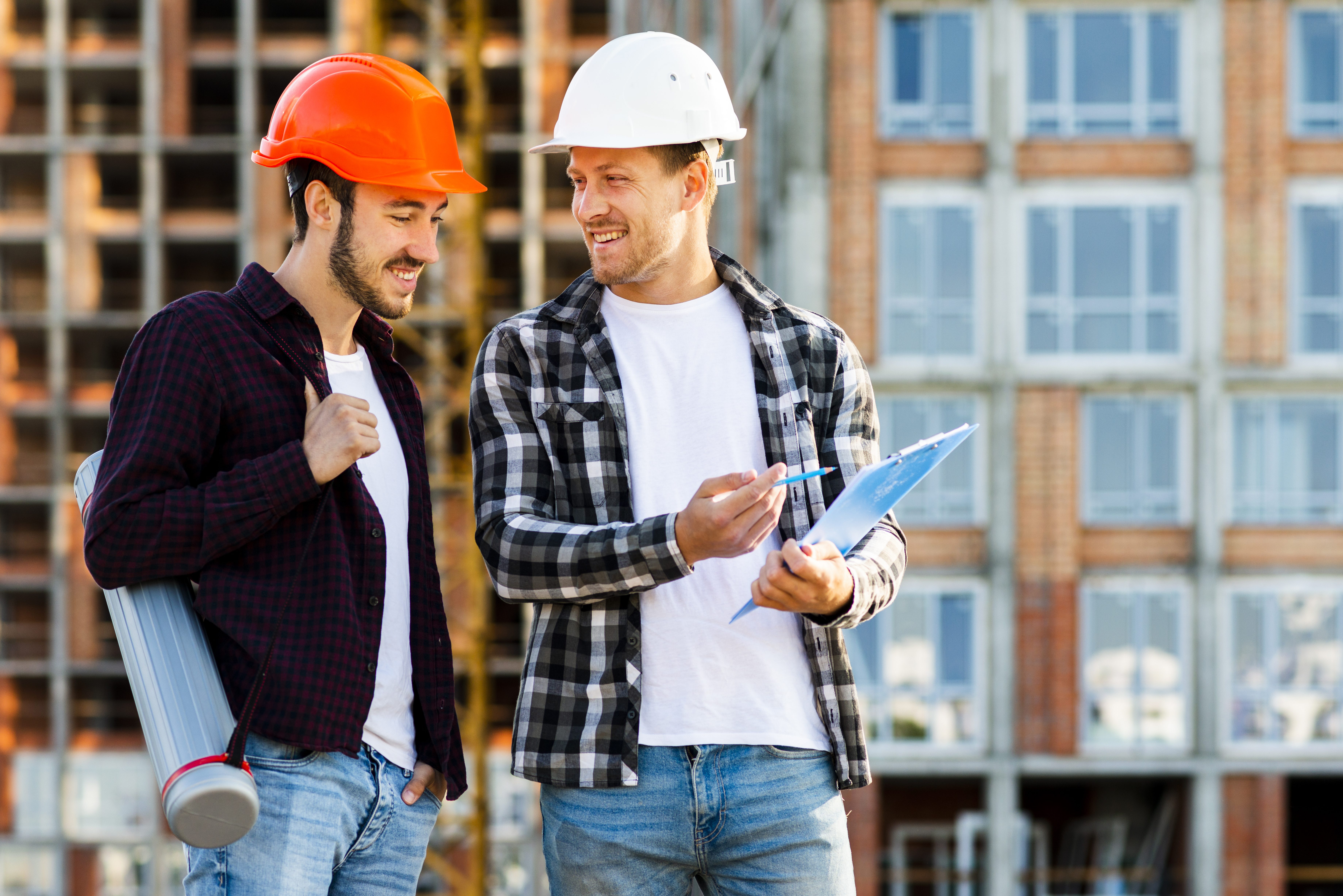 medium-shot-engineer-architect-looking-clipboard.jpg