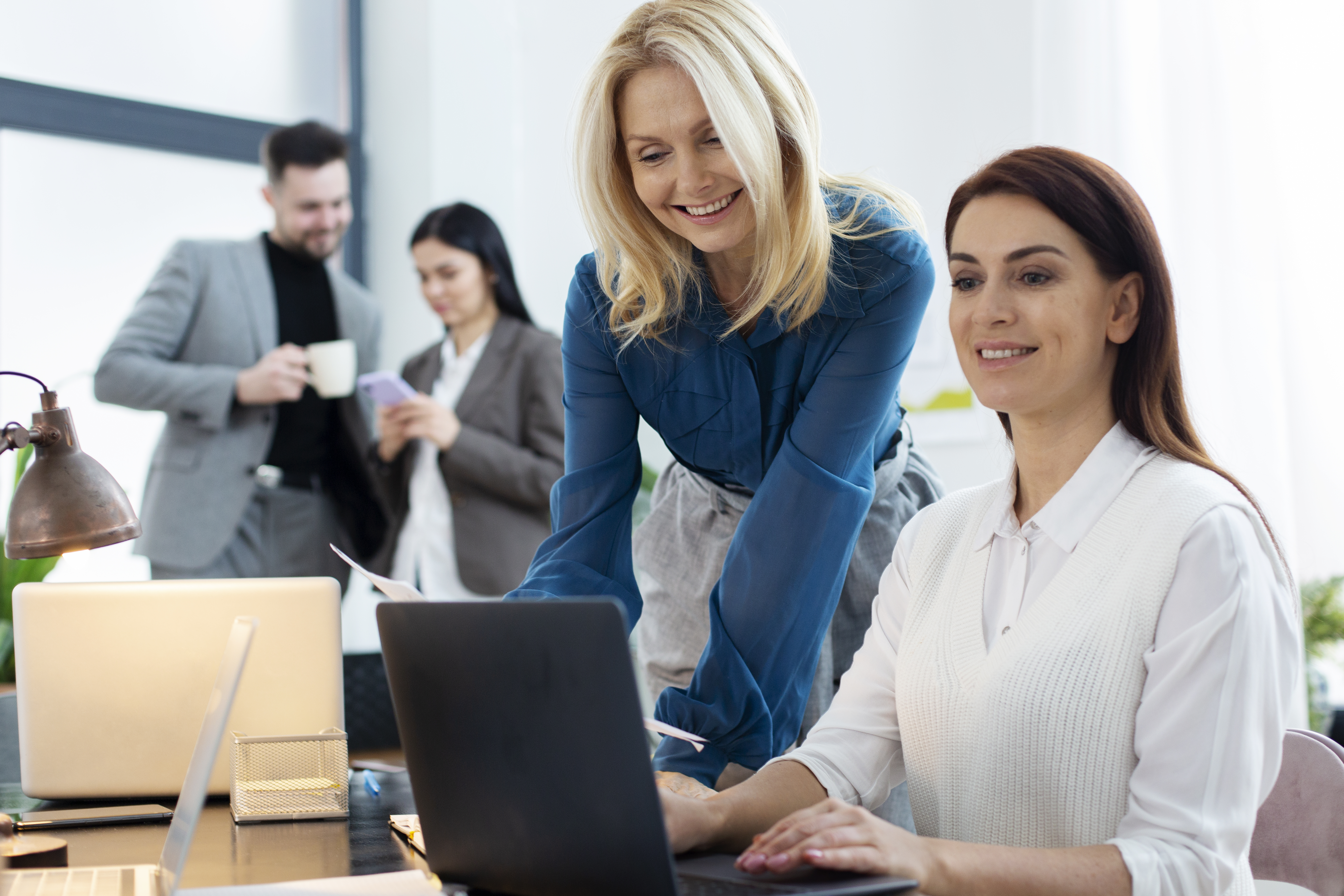 medium-shot-smiley-people-chatting-work.jpg