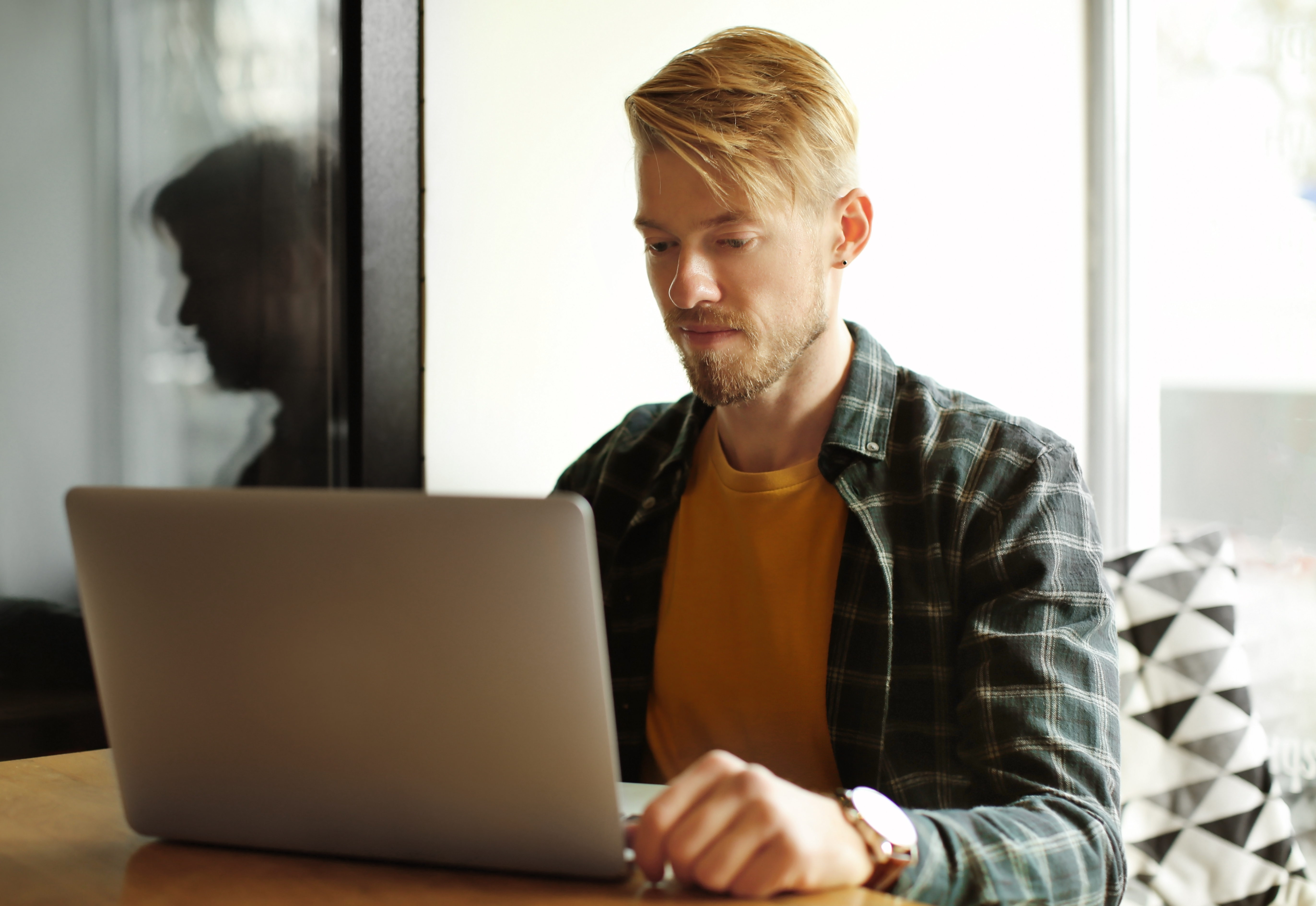 portrait-trendy-hipster-using-laptop-cafe.jpg