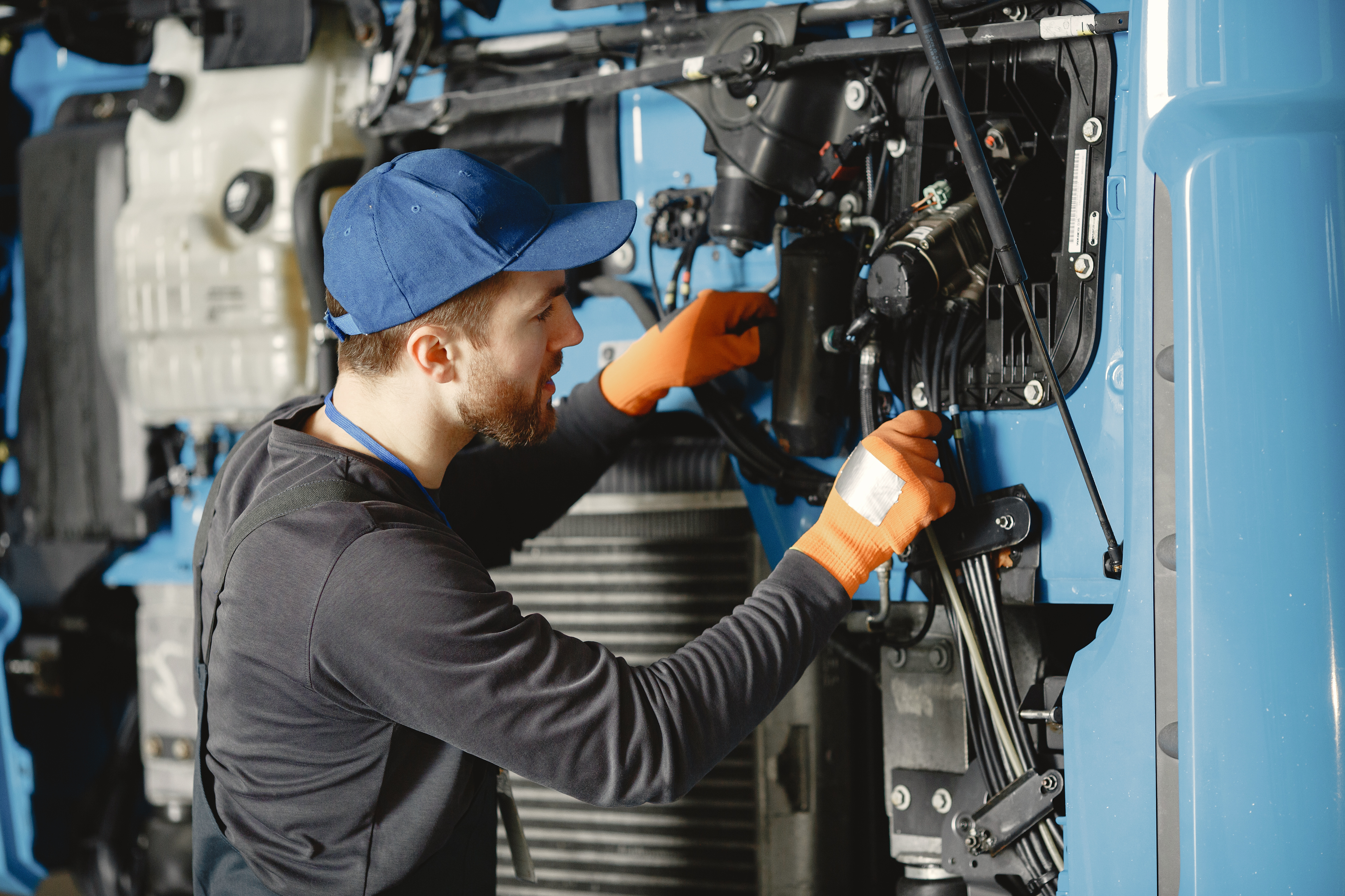 man-with-tools-truck-worker-uniform-faulty-truck.jpg