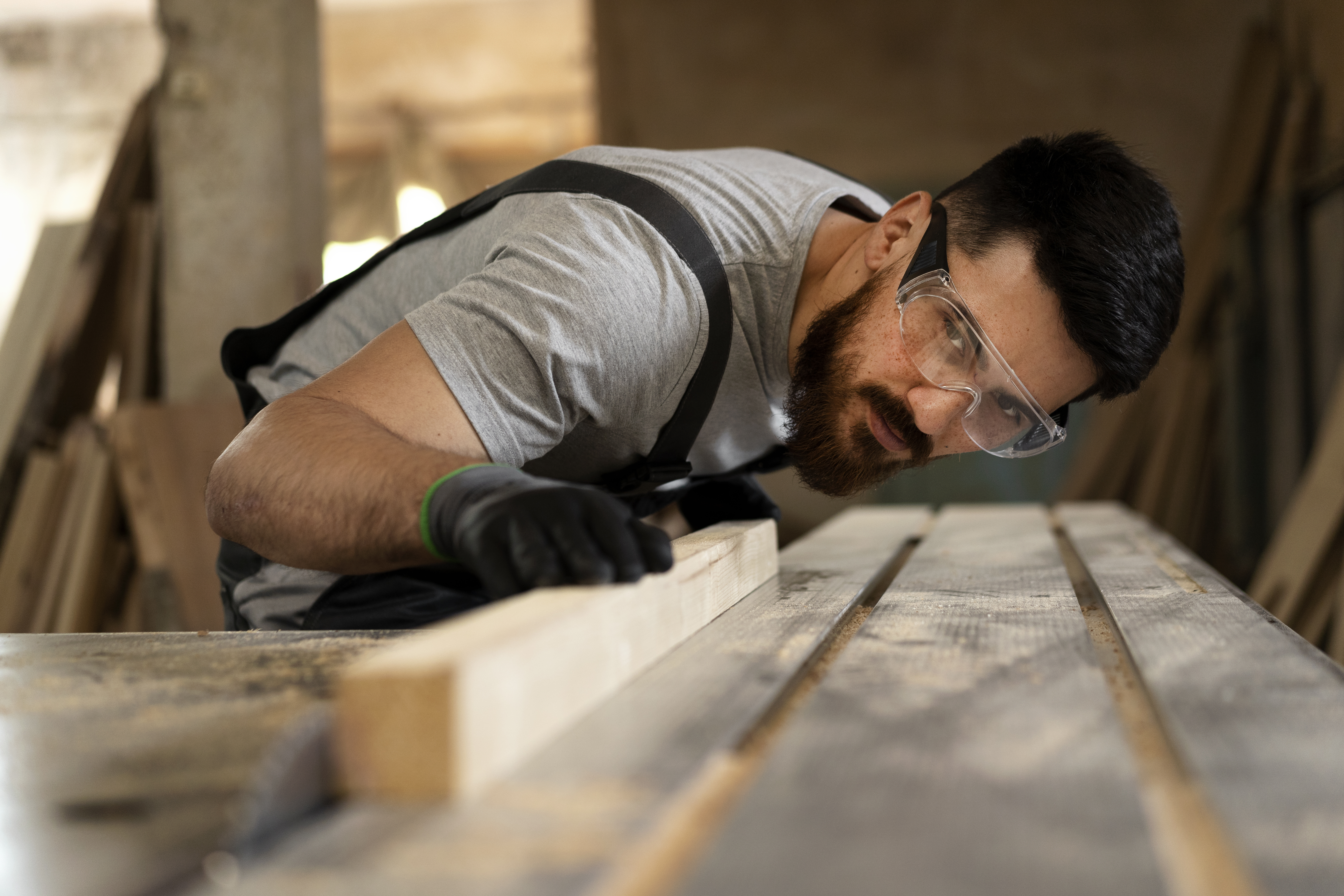 carpenter-cutting-mdf-board-inside-workshop.jpg