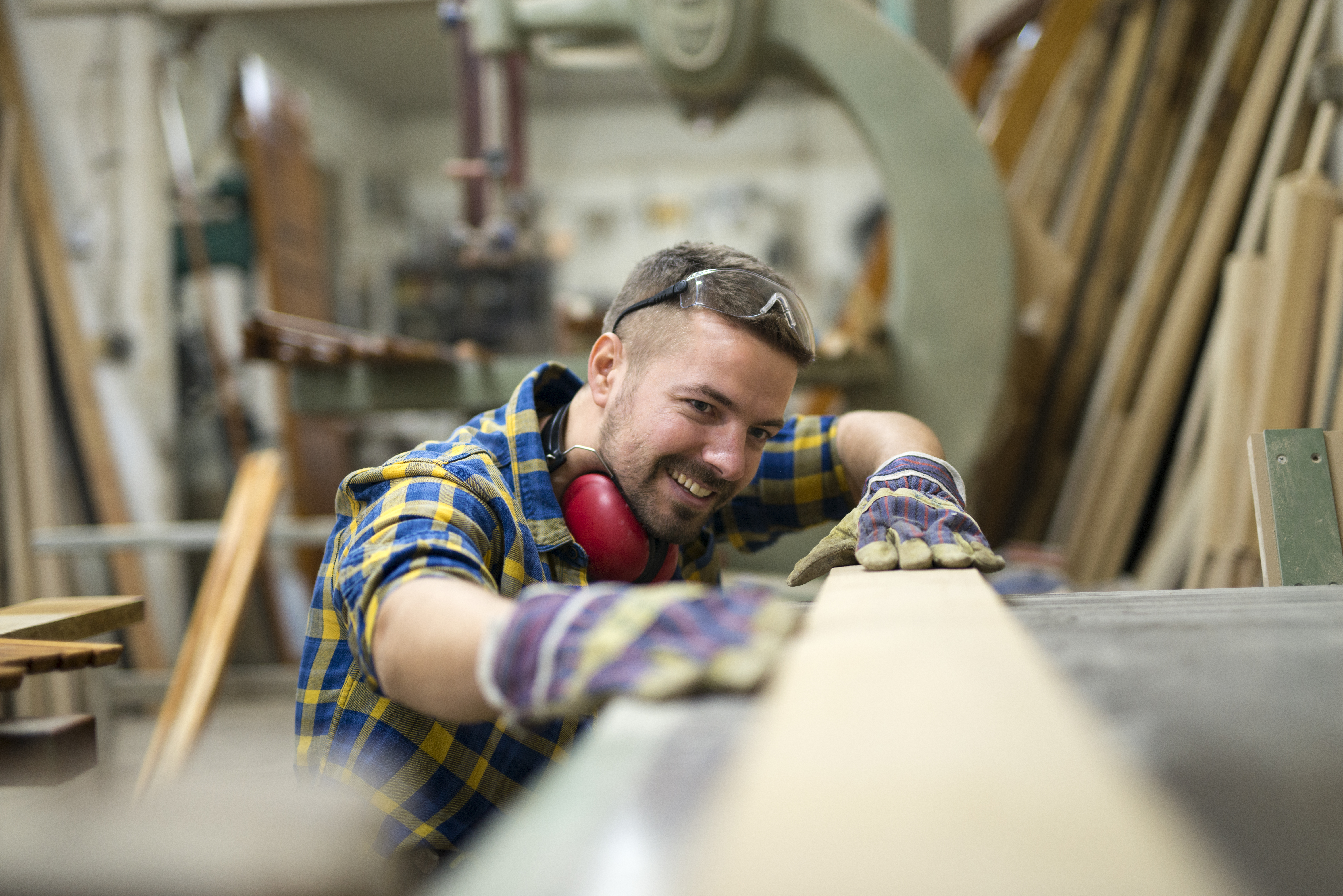 professional-carpenter-checking-smoothness-wood-product-workshop.jpg
