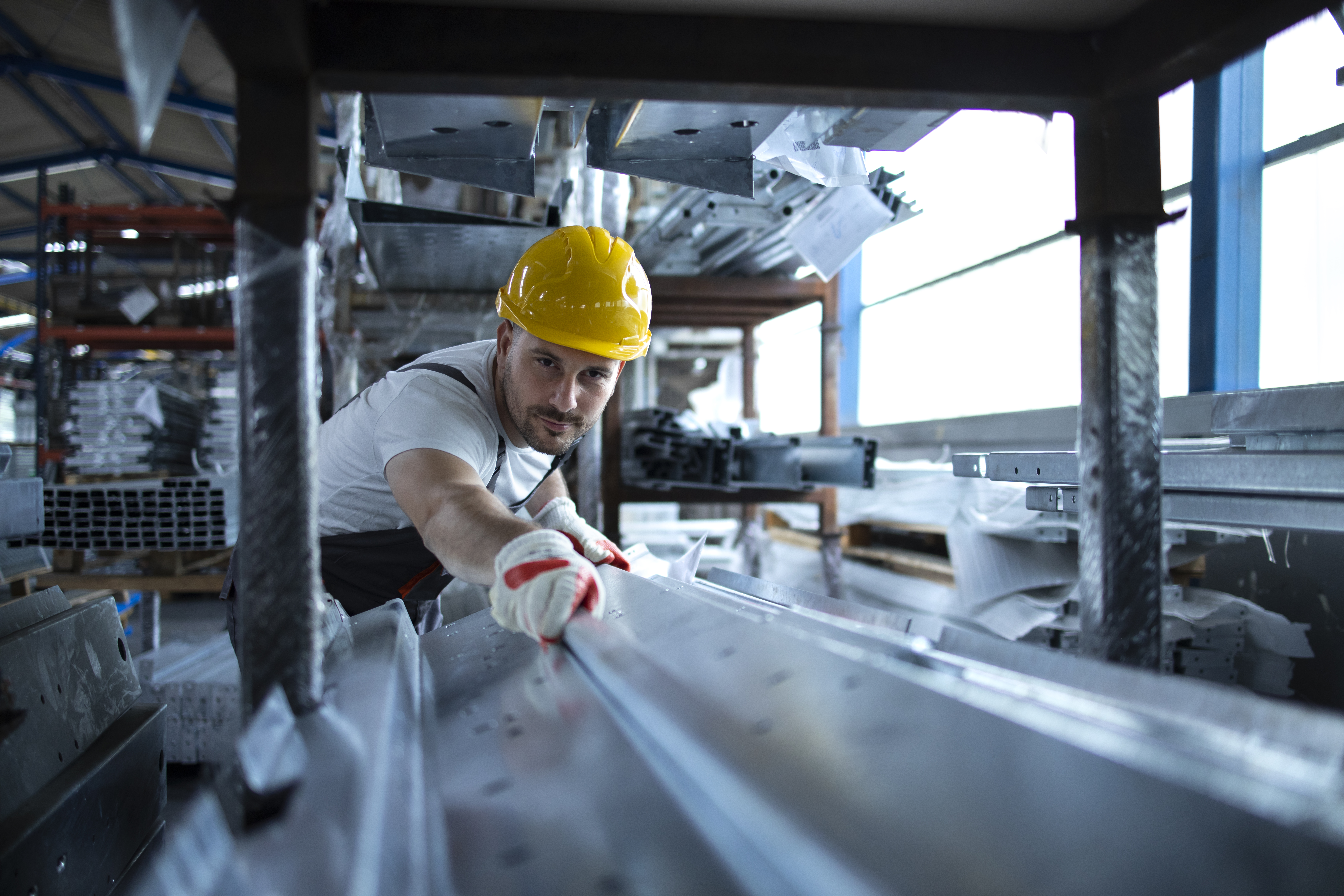 factory-worker-working-warehouse-handling-metal-material-production.jpg