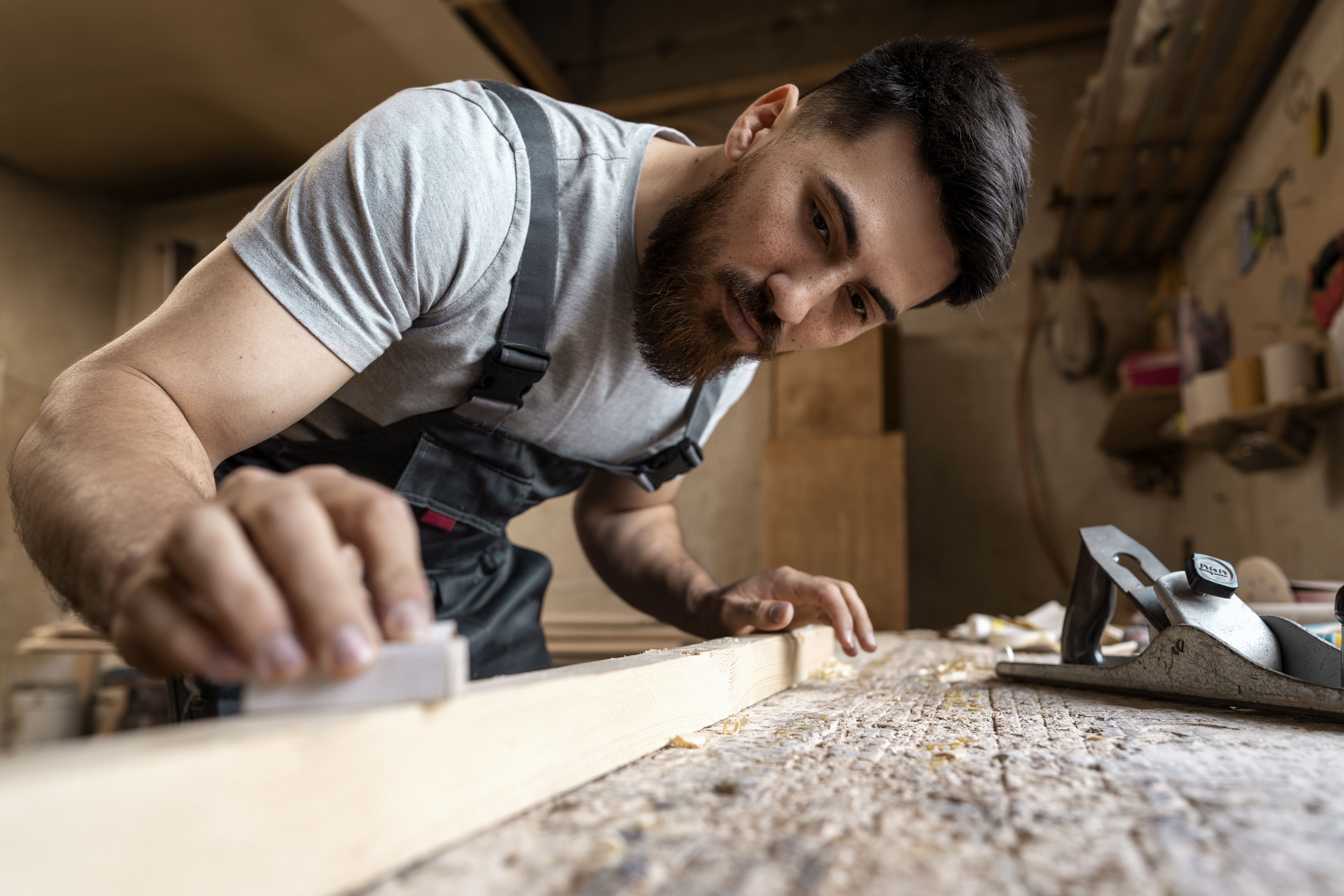 carpenter-cutting-mdf-board-inside-workshop.jpg
