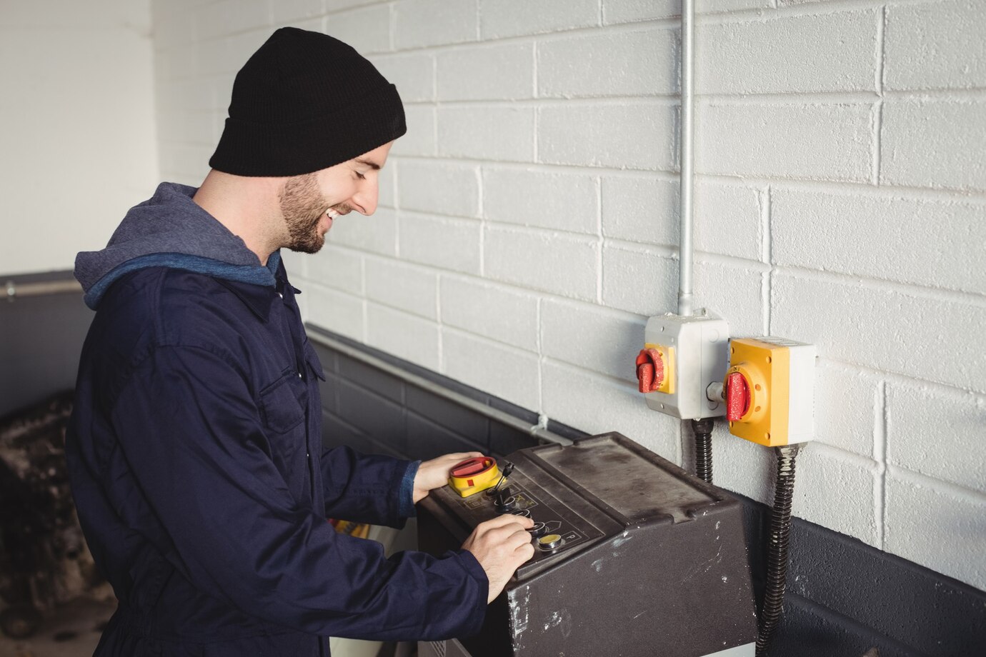 mechanic-using-control-box_107420-95947.jpg