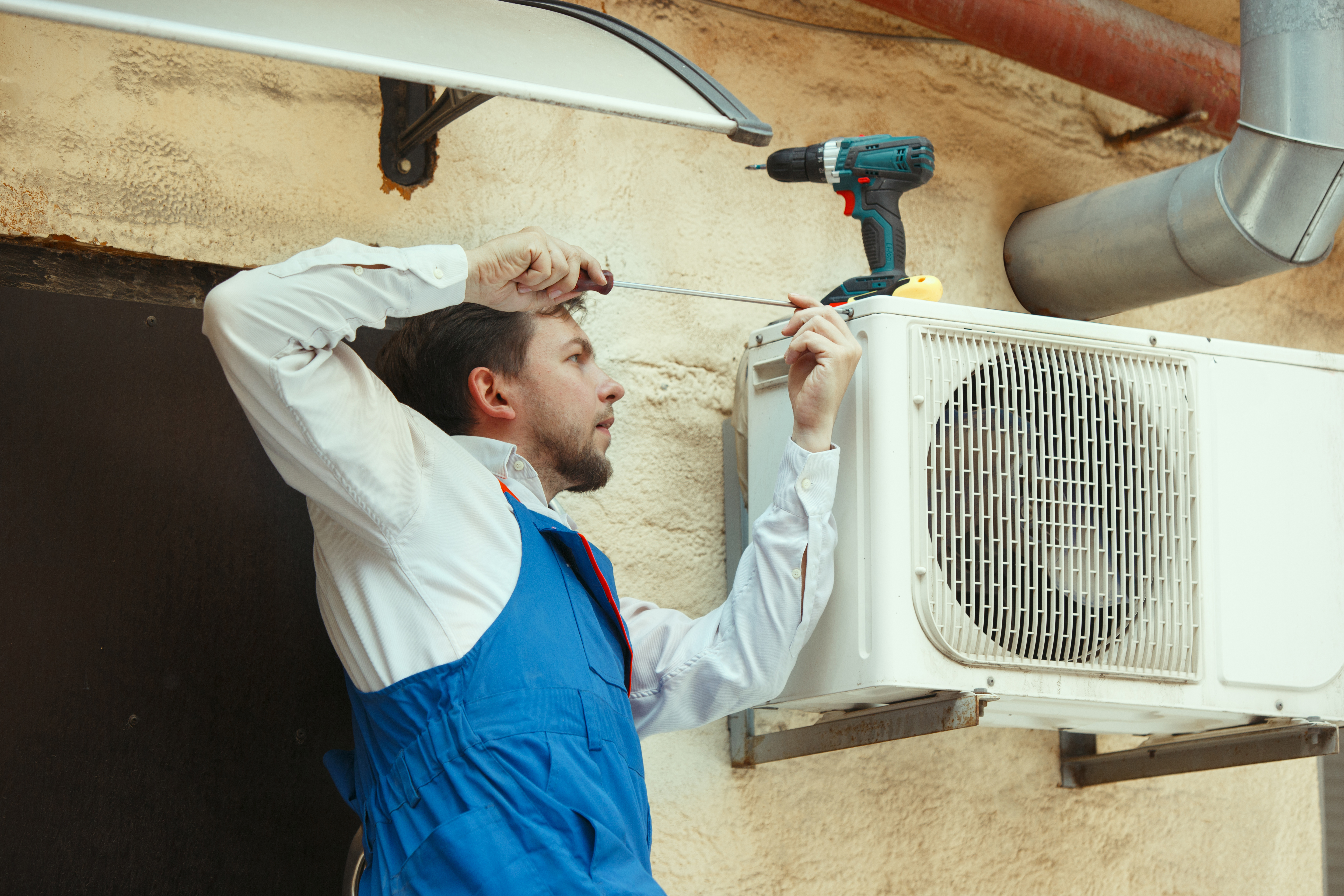 hvac-technician-working-capacitor-part-condensing-unit.jpg