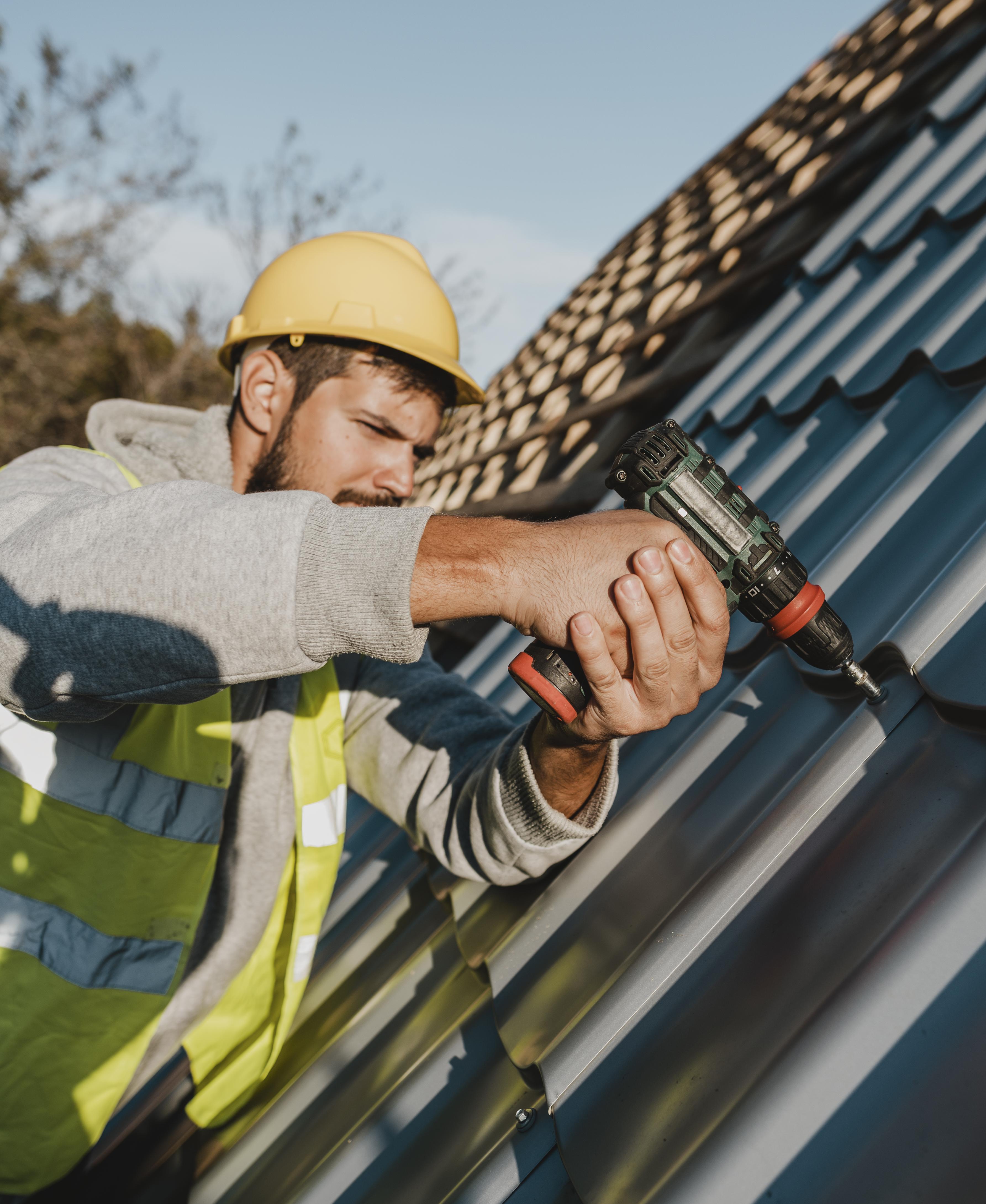 side-view-man-working-roof-with-drill.jpg