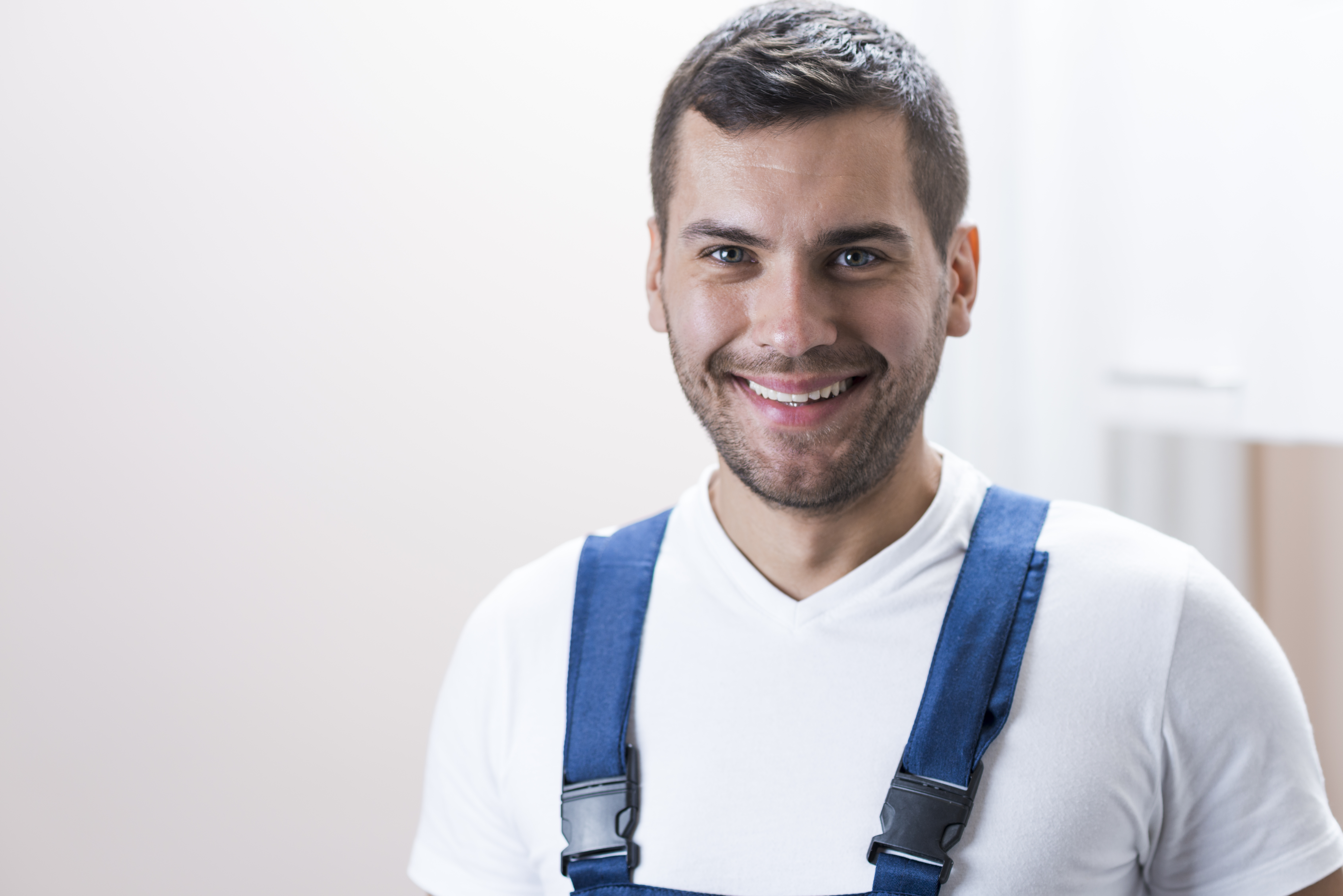 cheerful-workman-white-wall (1).jpg
