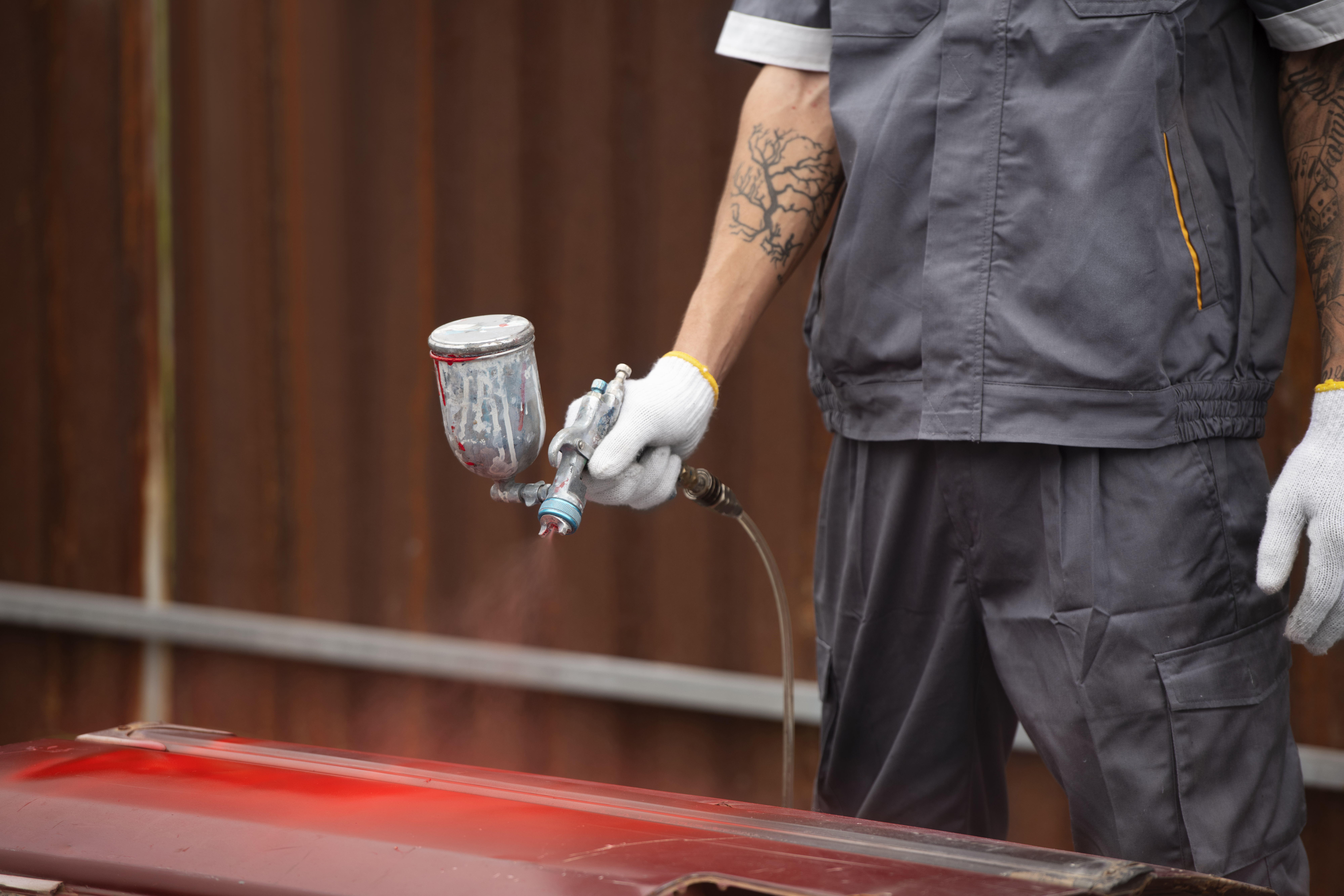 man-painting-car-door-side-view.jpg