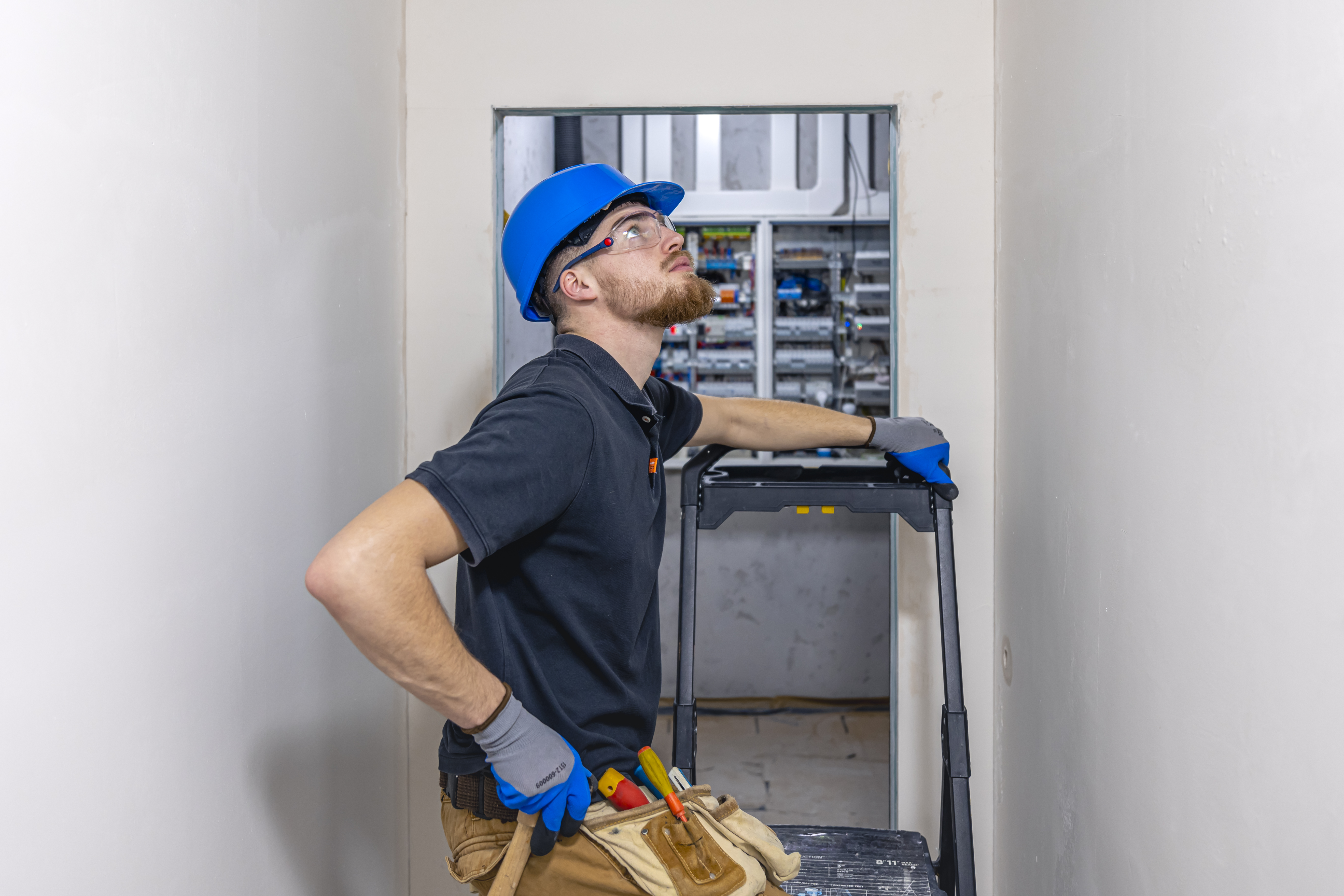 electrician-installing-laying-electrical-cables-ceiling-inside-house.jpg