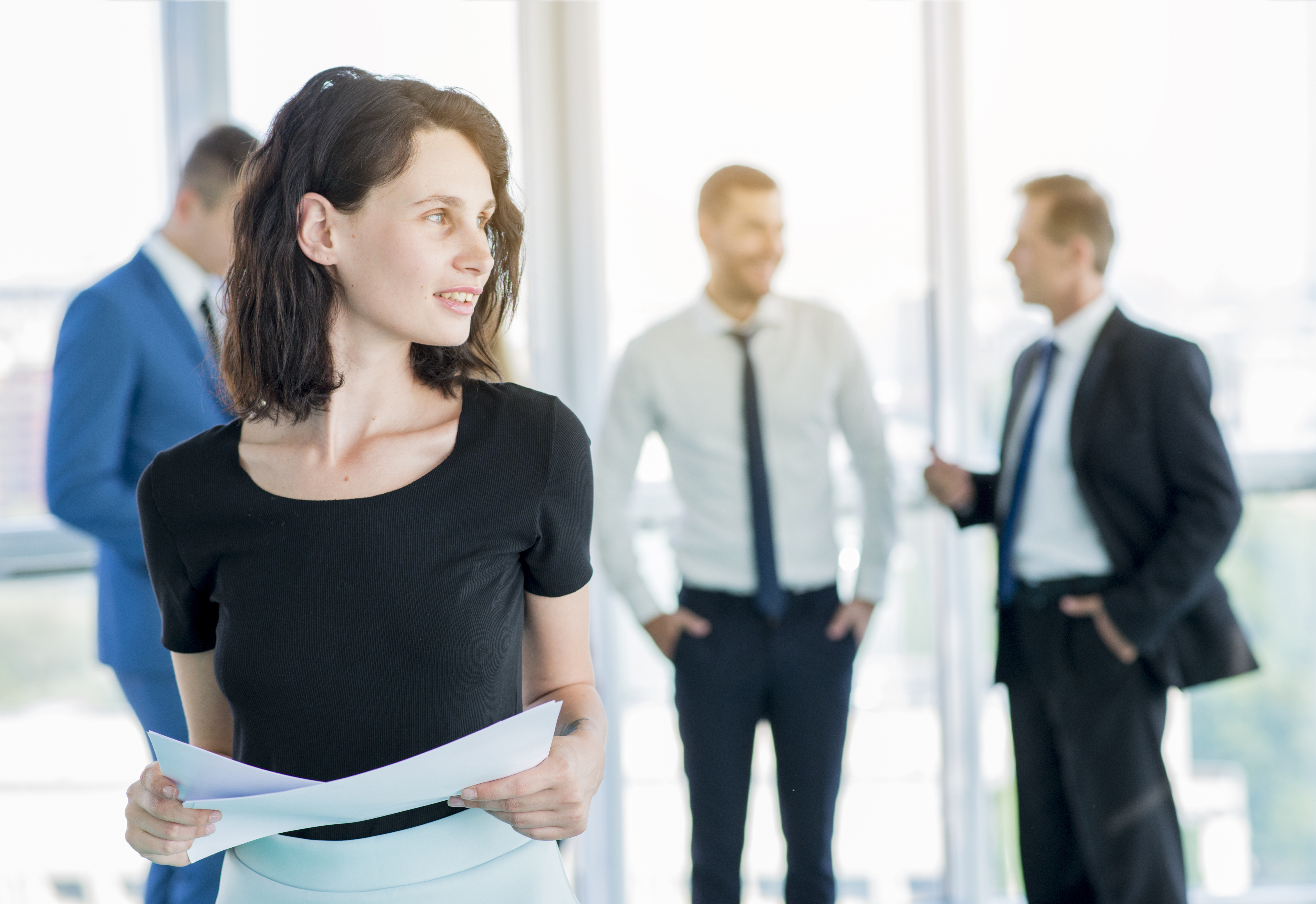 businesswoman-with-documents-looking-away.jpg