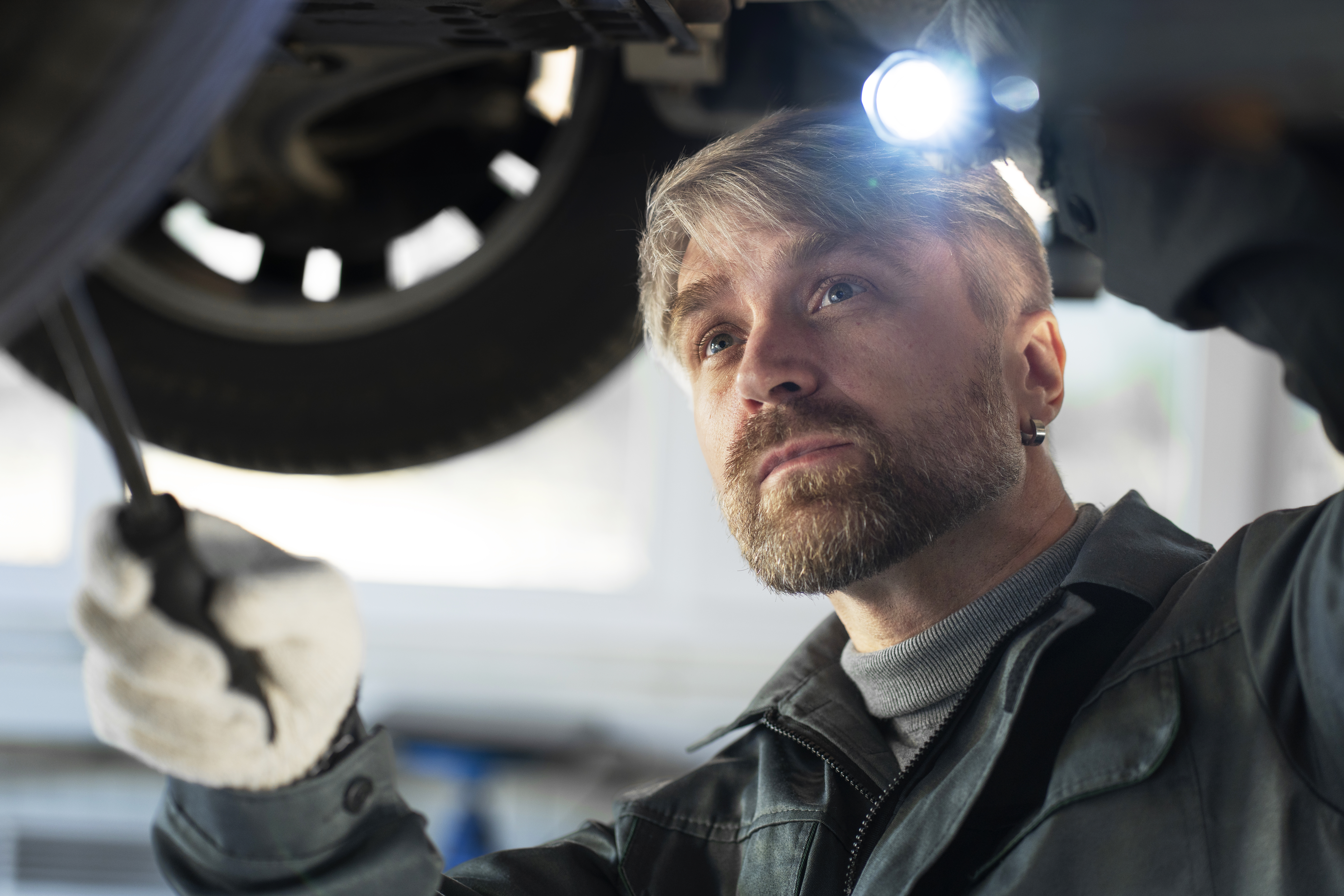 medium-shot-man-checking-car.jpg