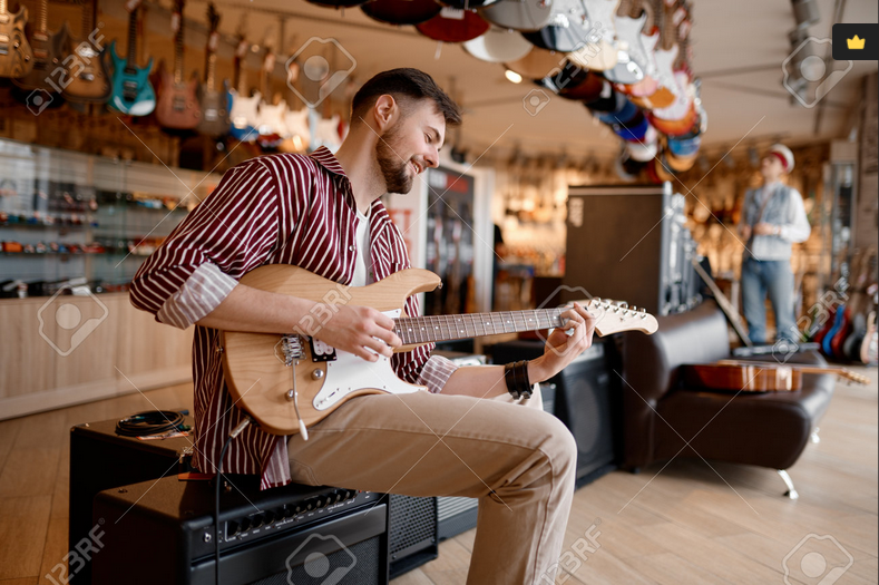 Screenshot 2024-02-27 at 19-47-51 Man enjoying sound while playing guitar connected to amplifier.png