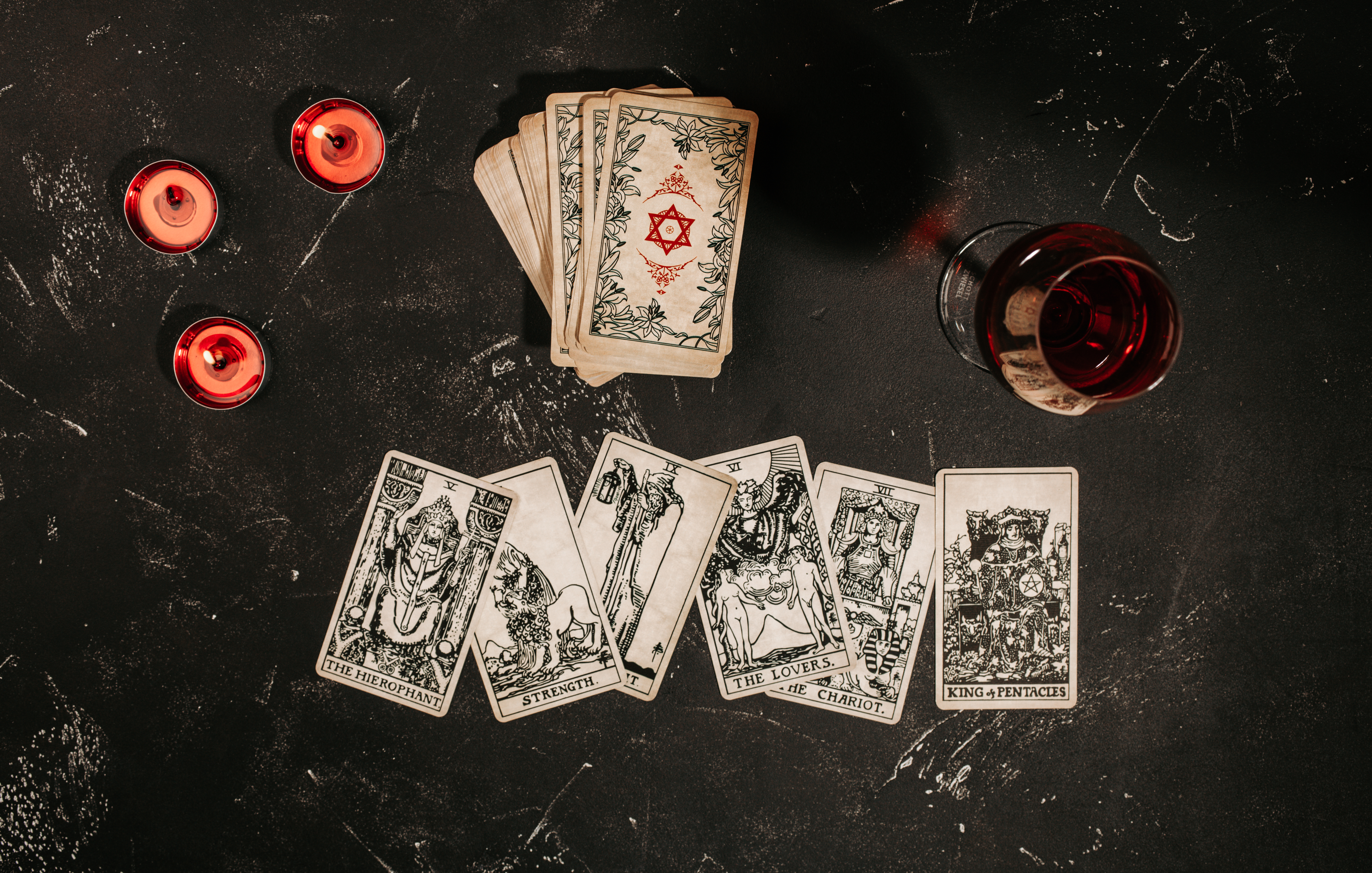 tarot-cards-on-red-background-occult-and-magic-2025-02-14-09-23-41-utc.jpg
