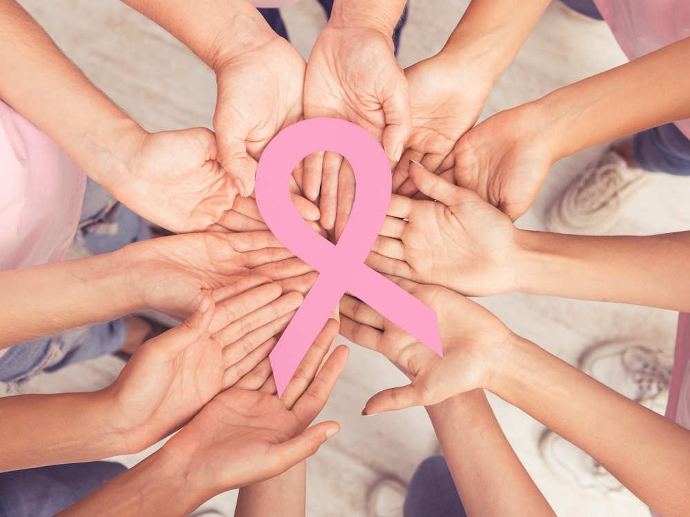 female-hands-circle-holding-big-pink-ribbon-standi-2023-11-27-05-10-18-utc.jpg