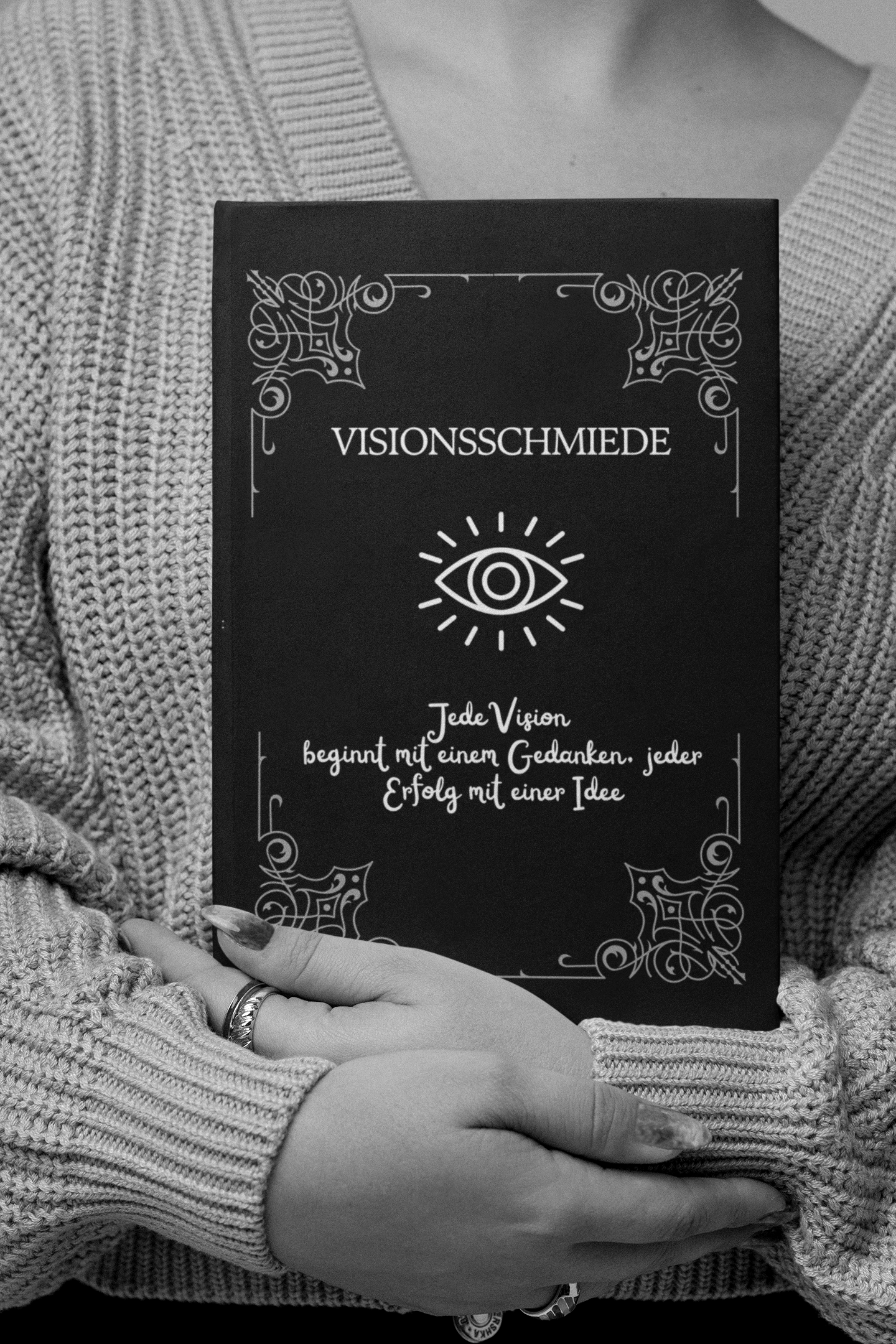 mockup-of-a-woman-with-long-nails-holding-a-book-m26947.png