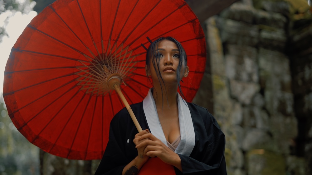 A asian woman with a red umbrella