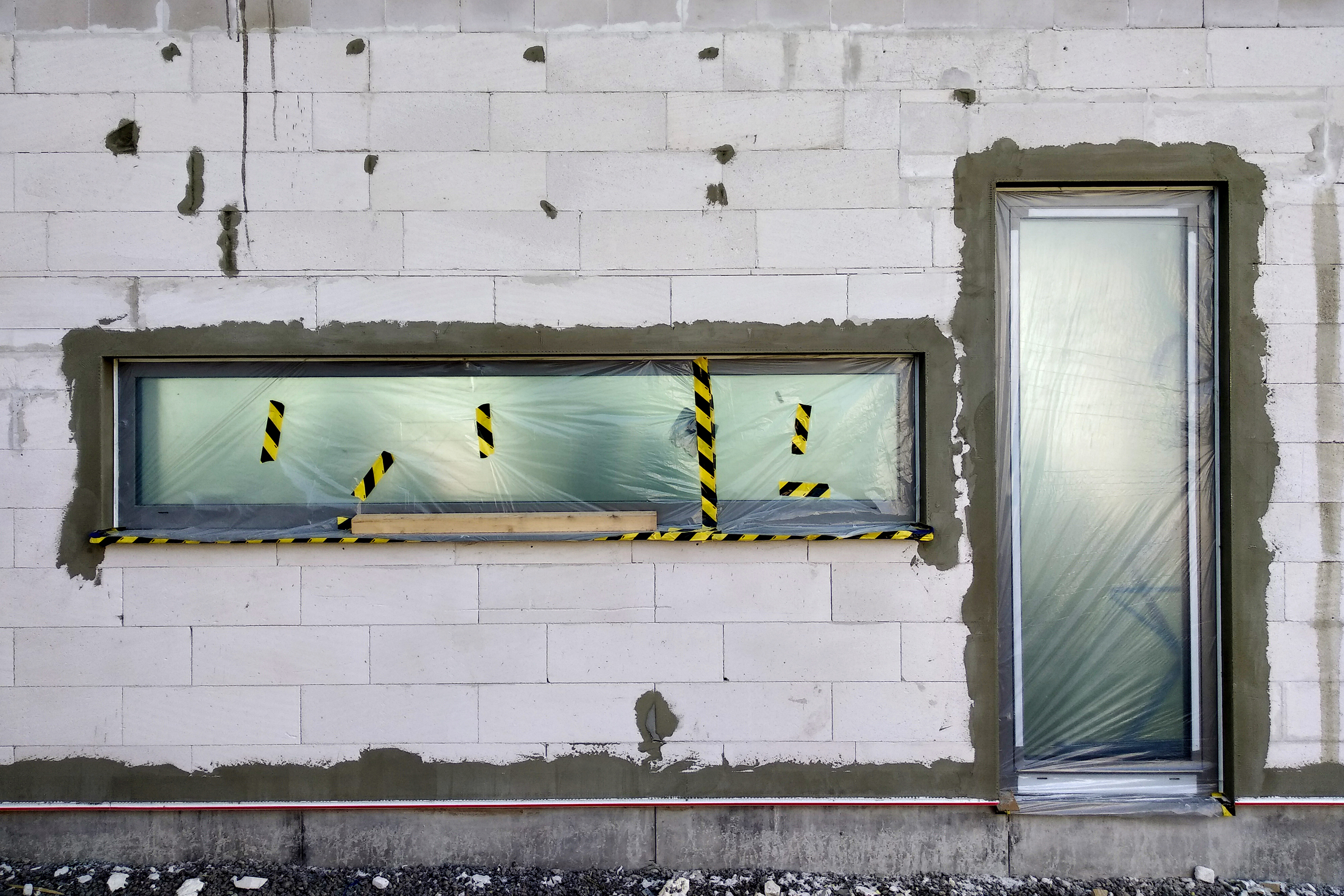 windows-of-a-house-under-construction-covered-with-2024-12-06-10-56-08-utc.jpg