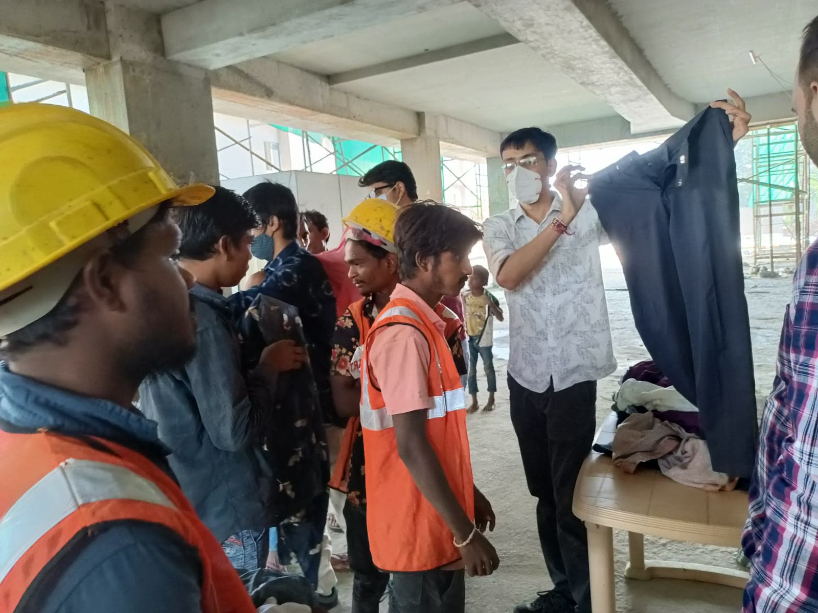 UUF volunteers distributing clothes during a community outreach event