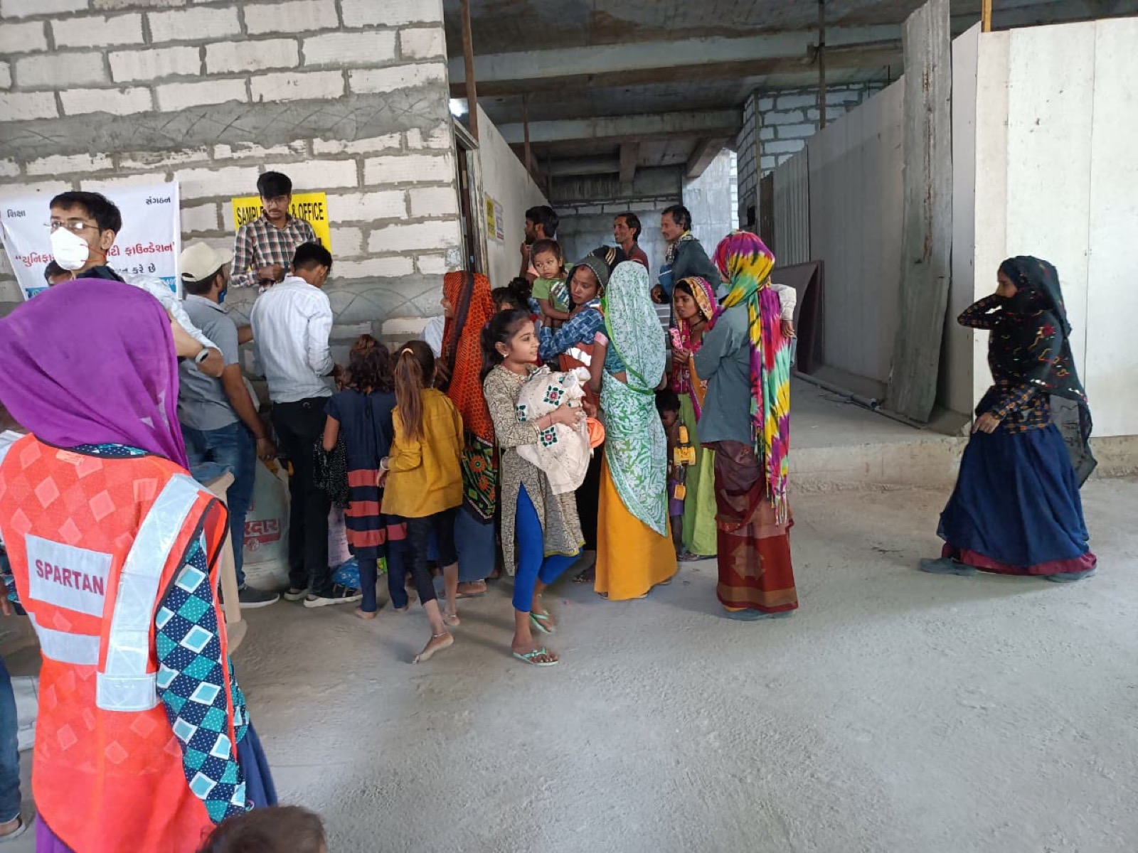 Community members gathered for a UUF clothing distribution activity