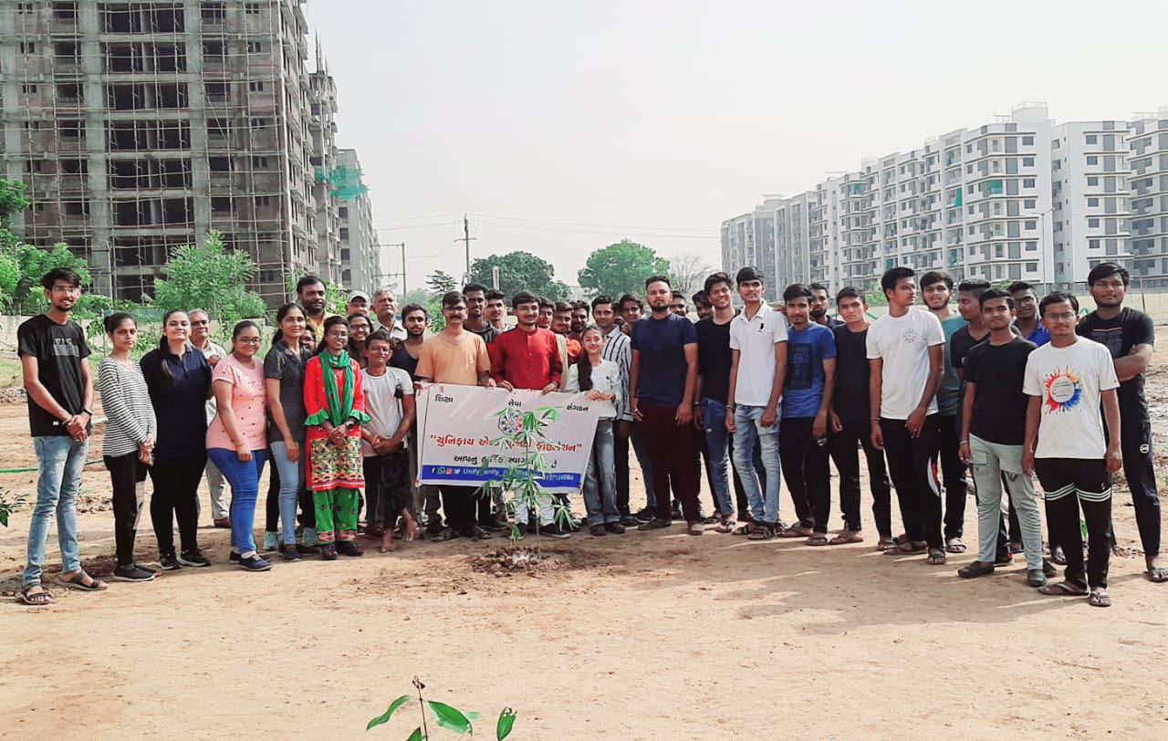 UUF volunteers planting trees during a plantation drive