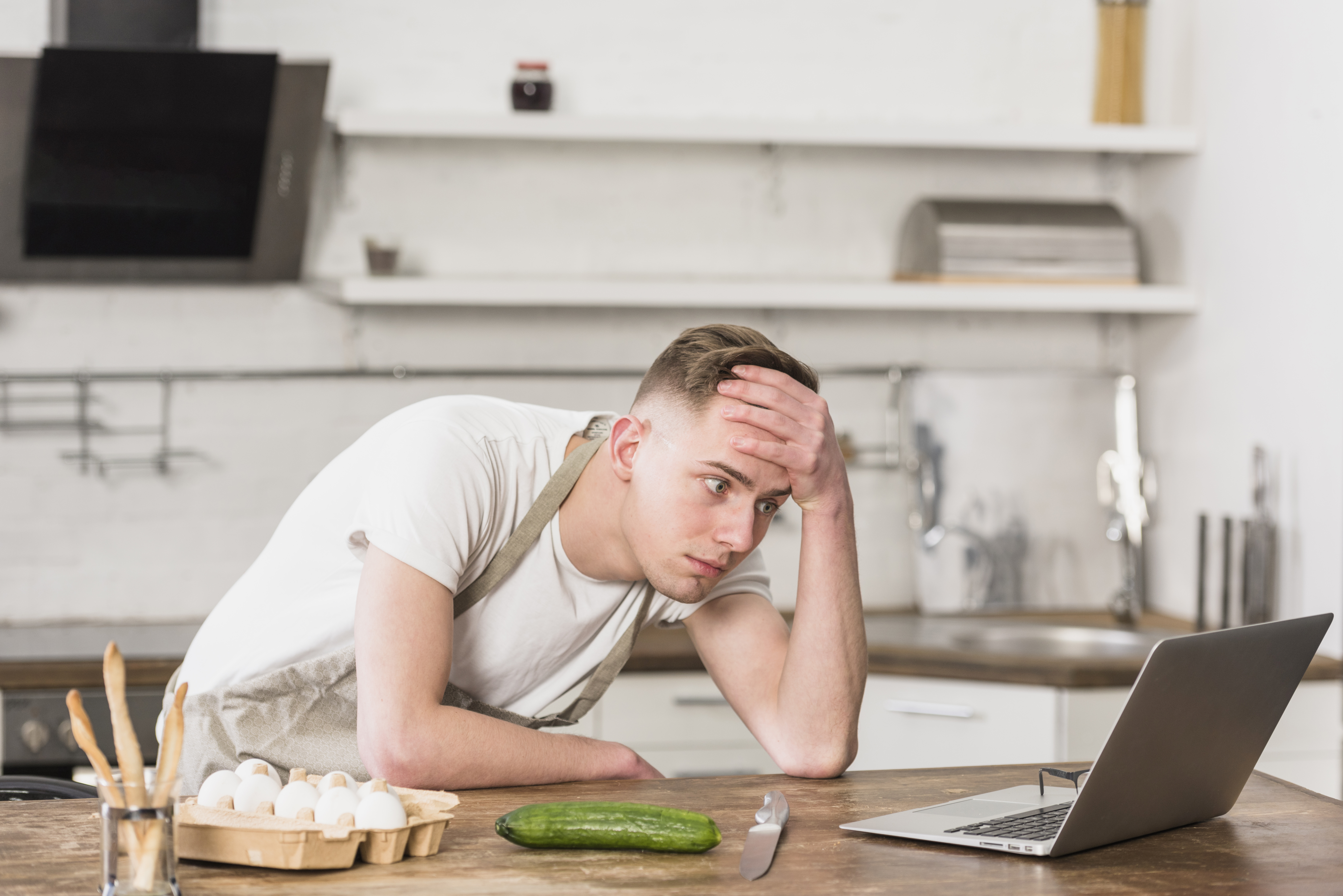worried-young-man-with-hand-his-forehead-looking-digital-tablet.jpg