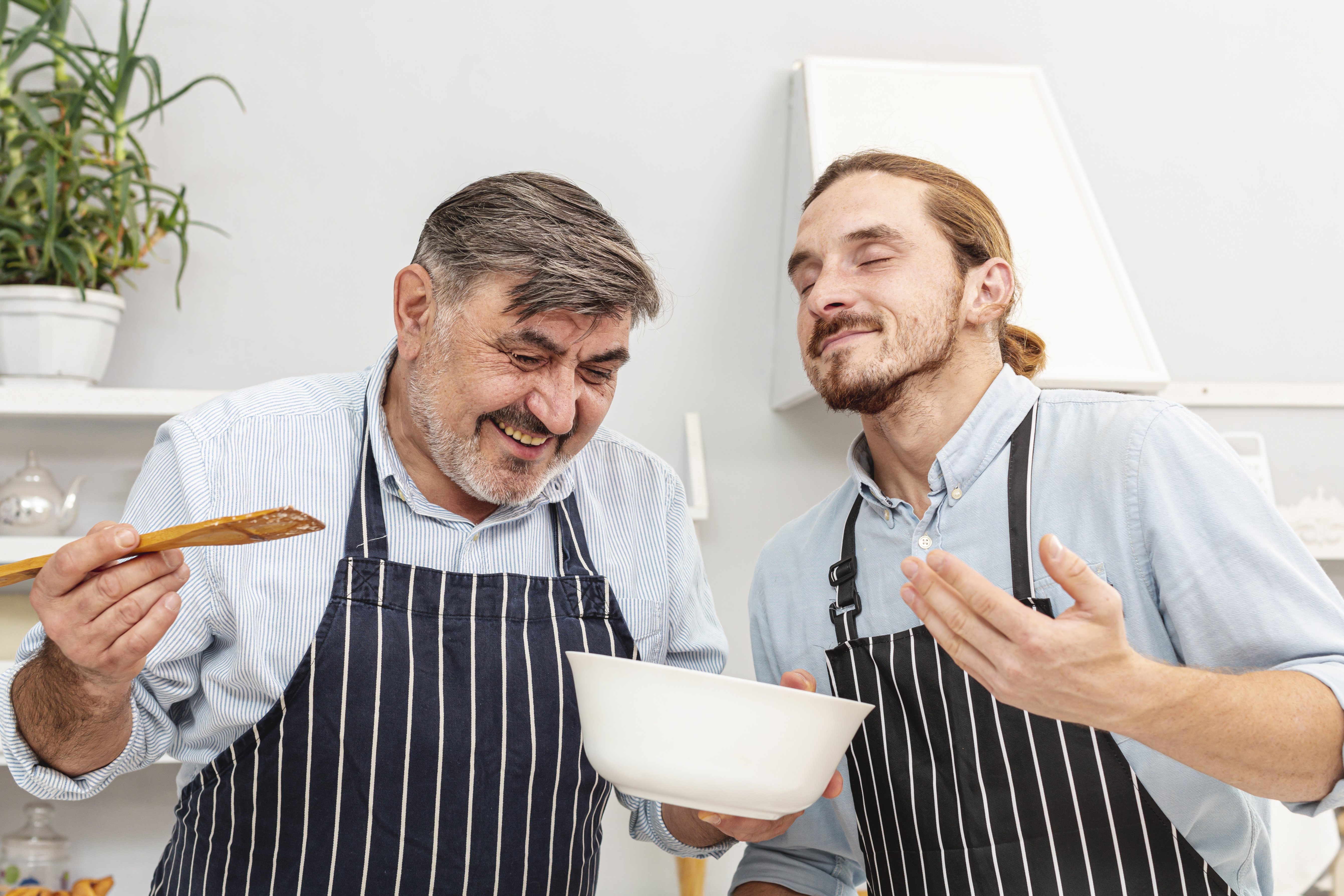 father-funny-son-tasting-dish.jpg