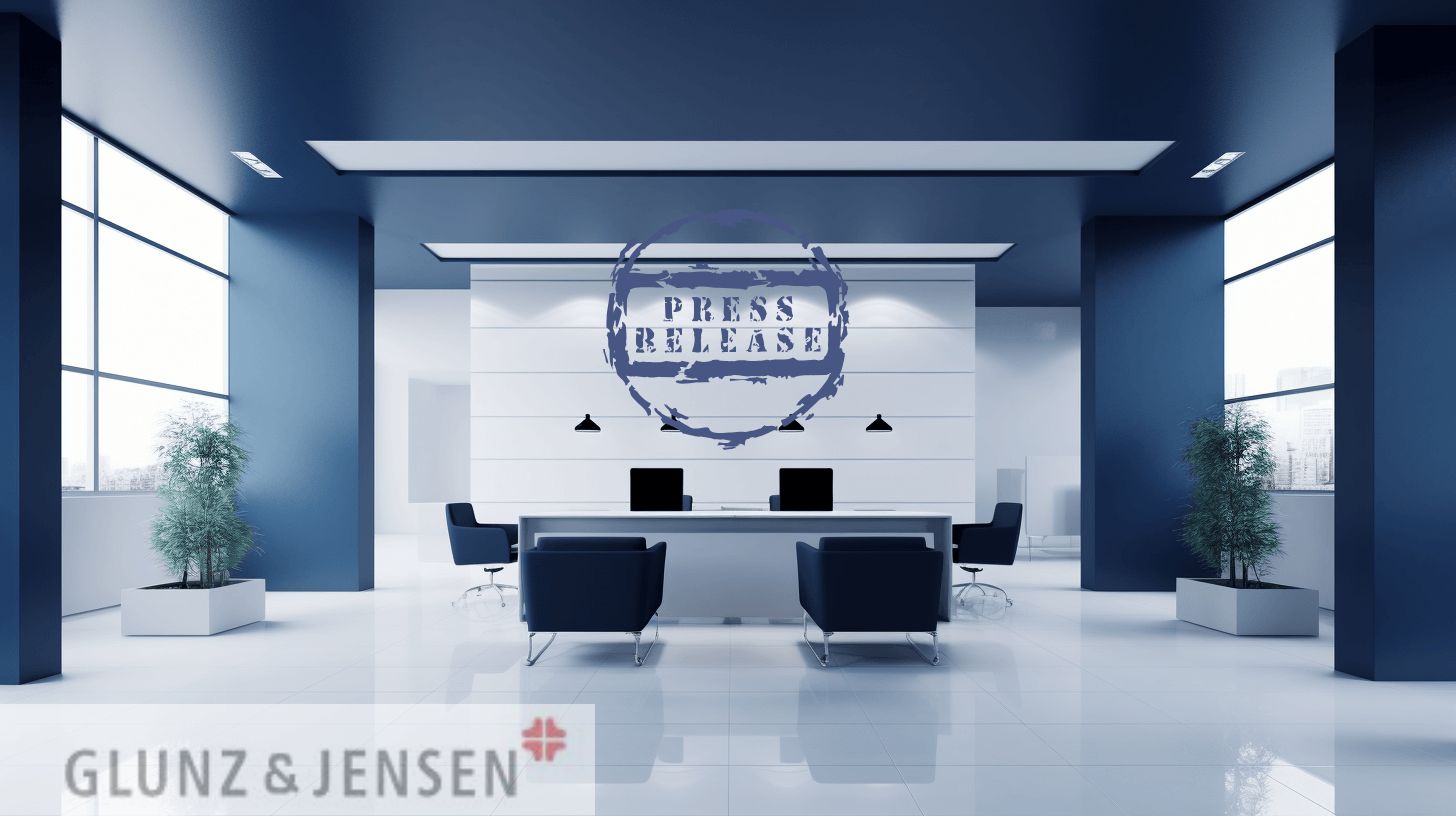 Futuristisk kontormiljø med "Press Release"-grafik og Glunz & Jensen-logo – symboliserer virksomhedens indtræden i det tyske medielandskab