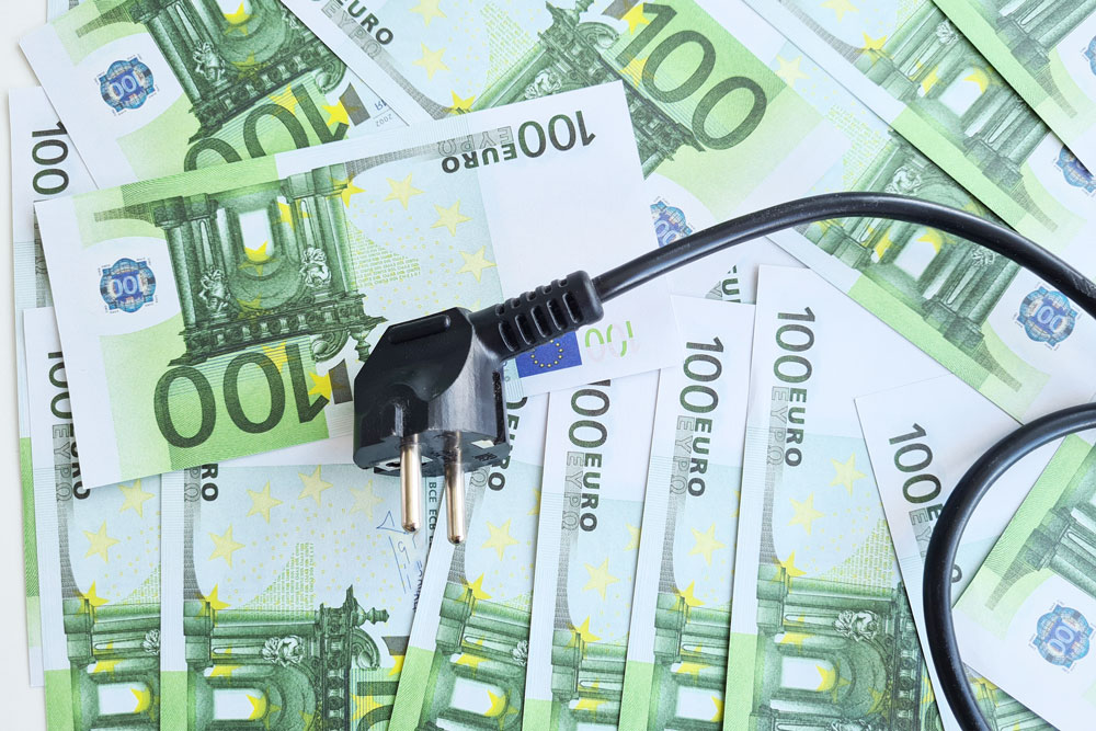 electrical-outlet-with-euro-banknotes-closeup-cost-inflation-rise-price-electricity-europe.jpg
